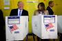 Americans choose between Clinton and Trump after bitter campaign Americans choose between Clinton and Trump after bitter campaign